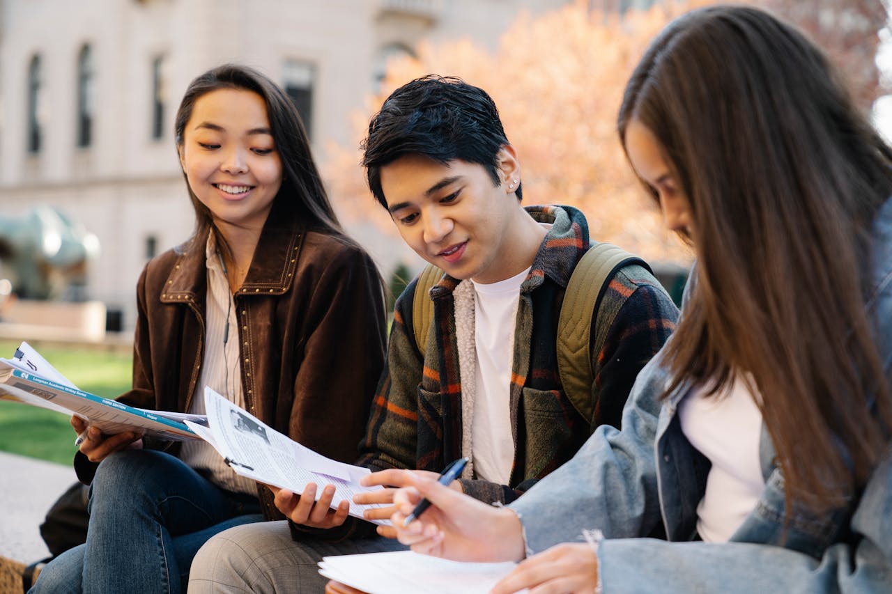 Crafting Captivating Headlines: Your awesome post title goes here Group of college students studying together on campus in autumn.
